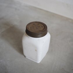 Old milk glass medicine bottle